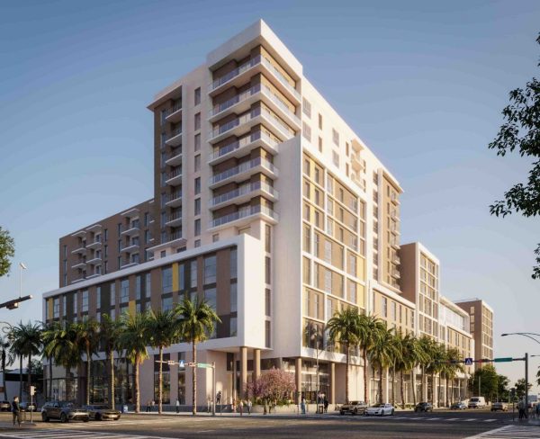 The 12 story building and street with vehicles and plantings