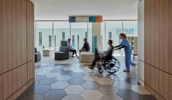 Patient waiting area with large windows and seating.