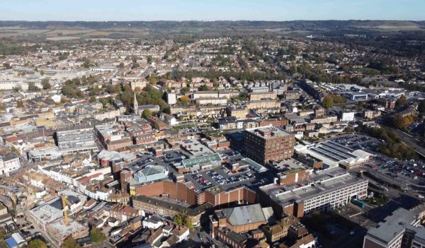 Aerial video of urban area in Maidstone with houses and commercial buildings